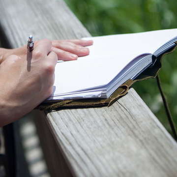 Writing in journal by waltstoneburner