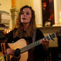 Katherine priddy playing guitar cropped 1 