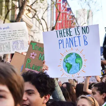 Climate emergency march sign reading no planet b by li an lim