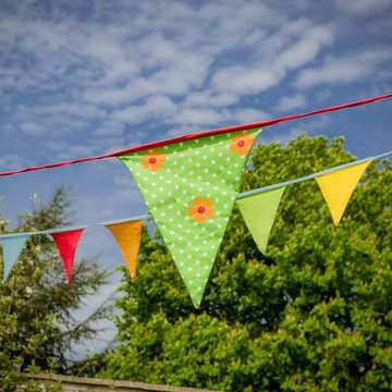 Bunting hanging in blue sky by foxy pixabay