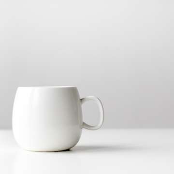 White mug on a table by nordwood themes