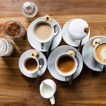 Different cups of coffee by cyril saulnier