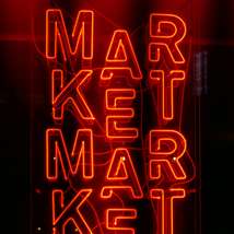 Neon market sign by karine germain