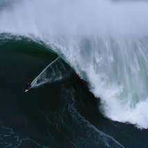 Andrew cotton surfing a big wave in portugal by savage waters   whipped sea hq width 1300px