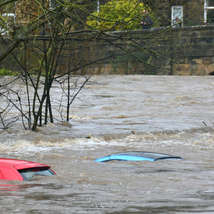Cars submerged at rise of river due to extraordinary rainfall and river bursting its banks by chris gallagher